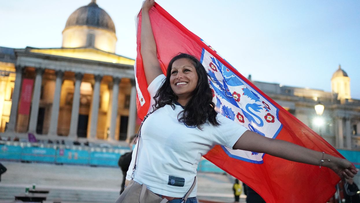 An England fan reacts in the fan zone in Trafalgar Square, London
