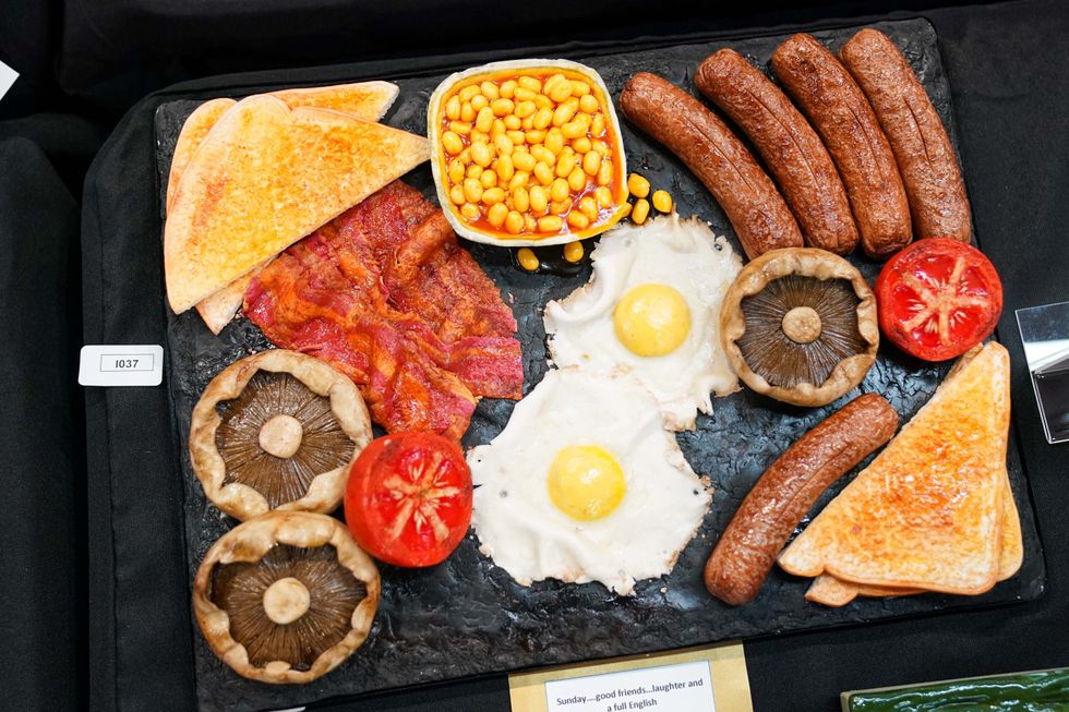 An English breakfast inspired cake was also on show (Jacob King/PA)