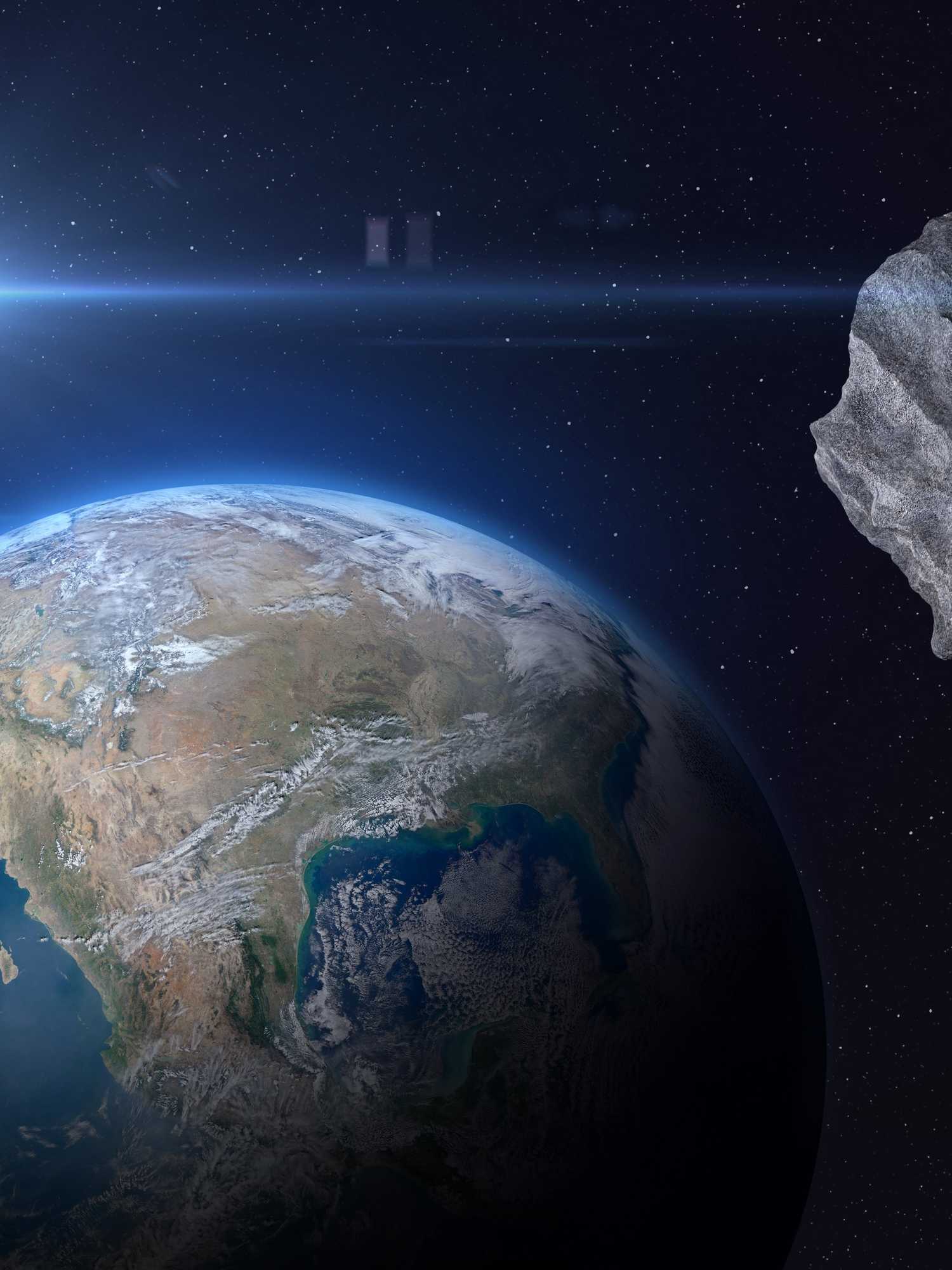 An image illustrating an asteroid heading for Planet Earth