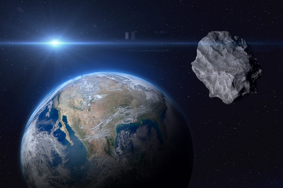 An image illustrating an asteroid heading for Planet Earth