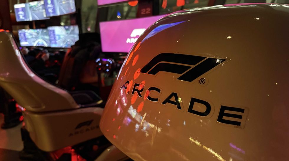 An image of the F1 Arcade logo on the back of one of the racing sims at F1 Arcade in London