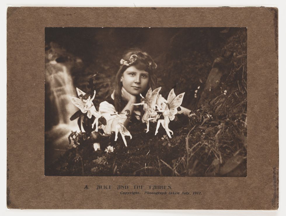 An image showing a girl with fairies