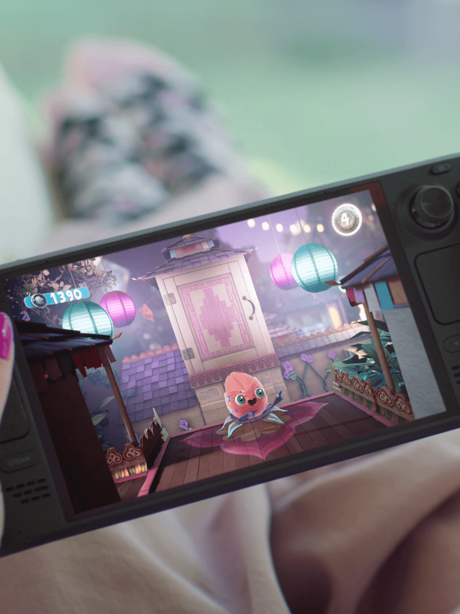 An official photograph of someone playing Sackboy on a Steam Deck OLED console