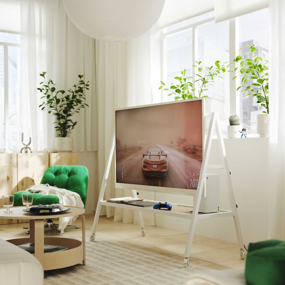 An official product image of the YXSTABY gaming TV stand on castors in white