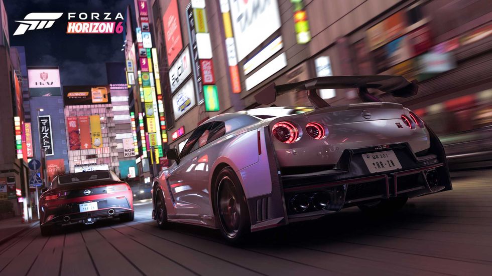 An official screenshot of a Nissan GTR racing through Tokyo's streets in Forza Horizon 6