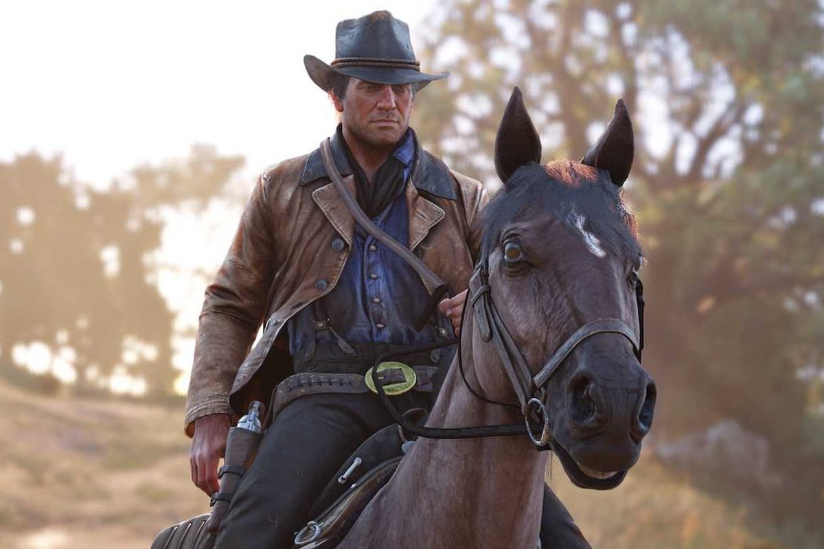 An official screenshot of Arthur Morgan on a horse in Red Dead Redemption 2