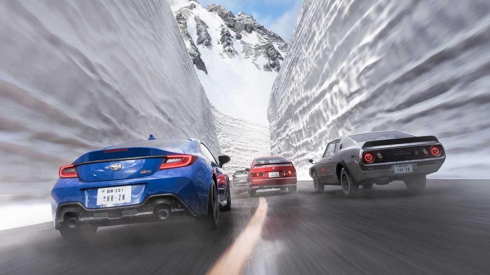 An official screenshot of cars racing through snow walls in Forza Horizon 6