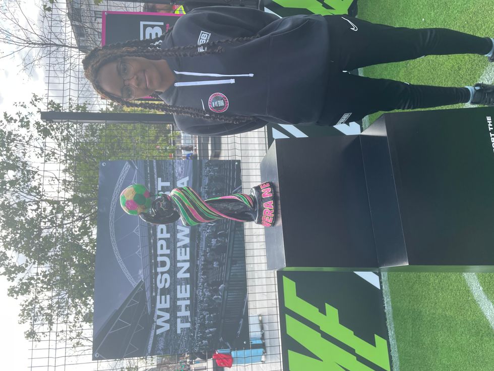 Anaiya Sutar poses next to the trophy