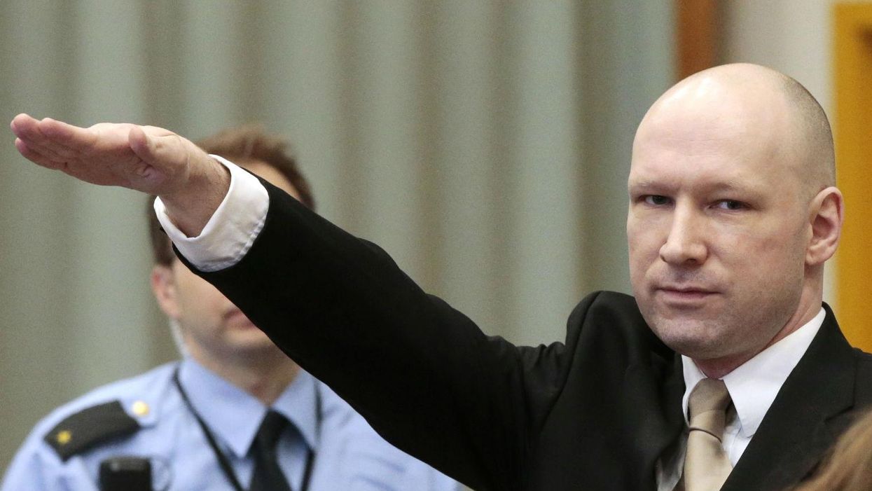 Anders Behring Breivik makes a Nazi salute as he enters the court room in Skien prison, March 15, 2016