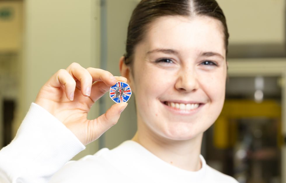 Andrea Spendolini-Sirieix holding up a coin
