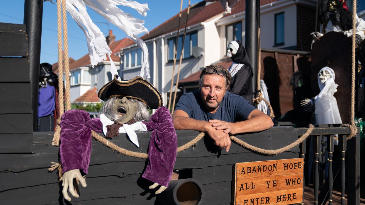 Andrew Carvel with his giant pirate ship (Joe Giddens/PA)