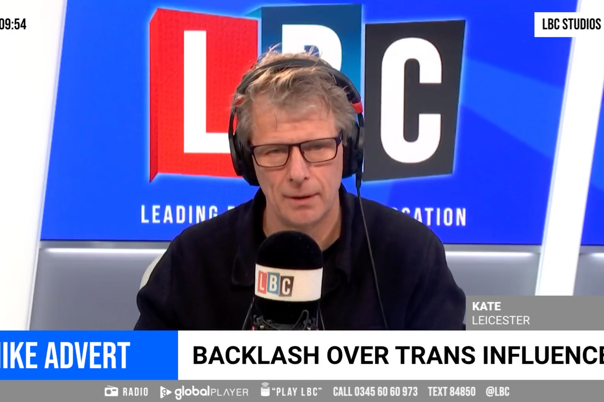 Andrew Castle, a white man with glasses, a black shirt and short grey hair, has an exasperated facial expression as he sits in the LBC studio. Chyron at the bottom of the photo reads: 'Nike advert: Backlash over trans influencer'.