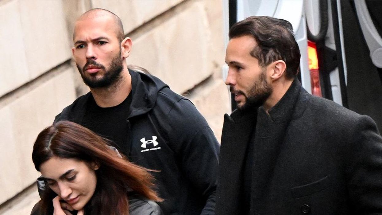 Tate fans say 'only Allah can judge him' as he enters court with Quran