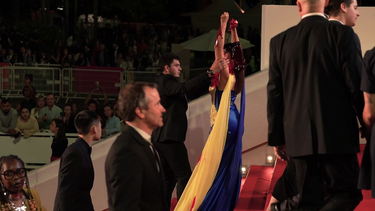 Model at Cannes covers herself in bags of blood hidden in her cleavage