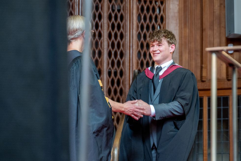 Archie Wills-Johnson, 22, receives his master's degree (Nim Jethwa/University of Bristol/PA)