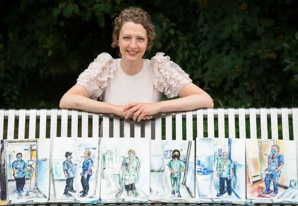 Artist Gillian McLaren with her portraits (Lesley Martin/PA)