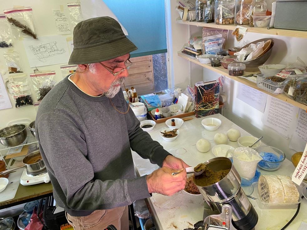 Artist Nabil Ali works with the bark in his workshop. (Louise Walsh/ PA)