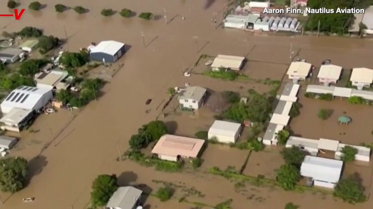 Australian towns are being flooded with crocodile-infested waters