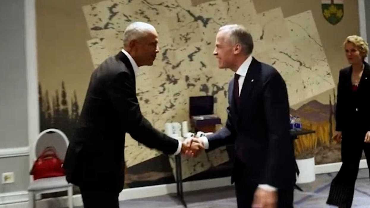 Barack Obama, left, shakes hands with Mark Carney, right.