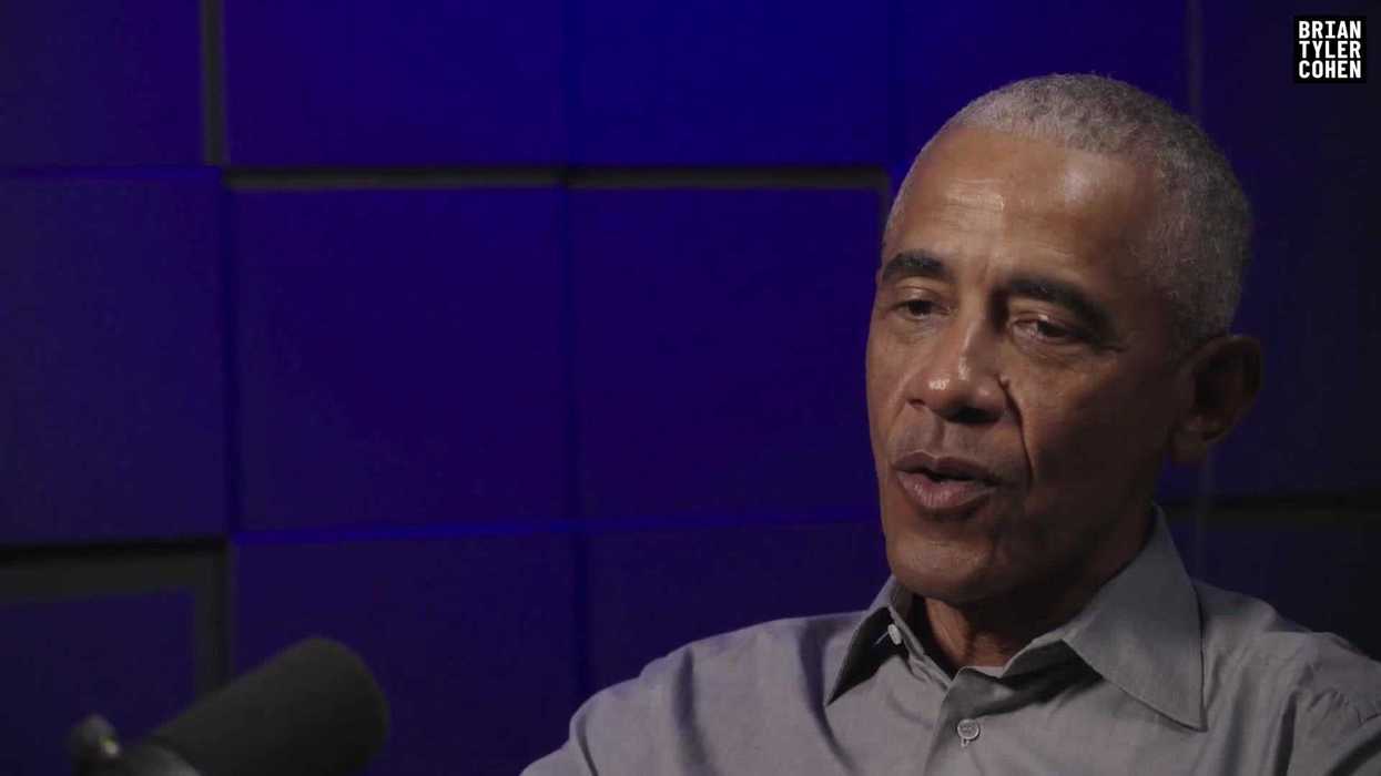 Barack Obama speaking in a podcast studio.