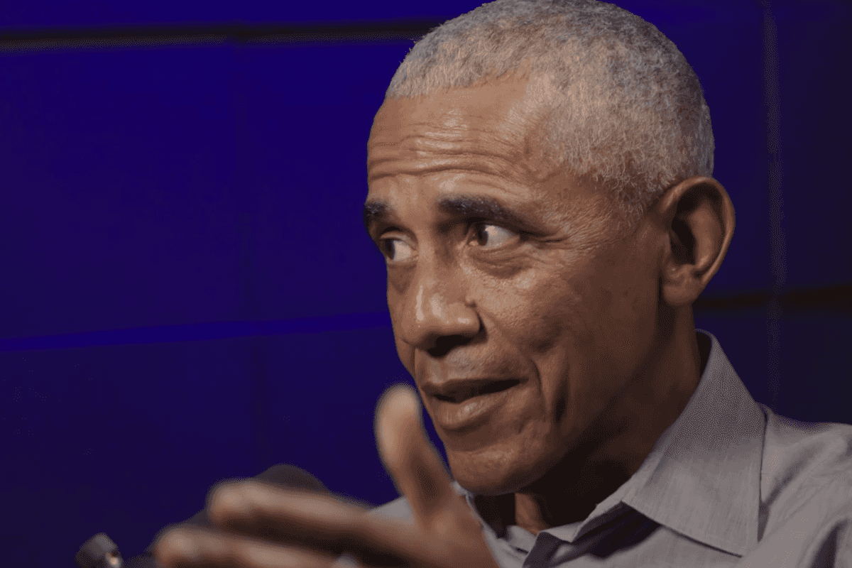 Barack Obama speaking in a podcast studio.