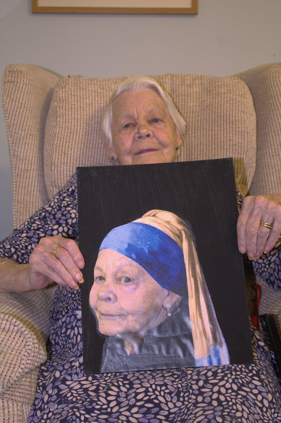 Barbara with her rendition of Johannes Vermeer\u2019s Girl with a Pearl Earring (Care UK)