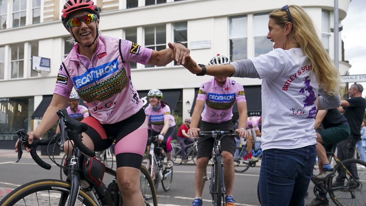 Batley & Spen MP Kim Leadbeater greets the Jo Cox Way cyclists, a group of 70 mixed ability cyclists, at Flat Iron Square in Southwark, London, following their five-day journey from West Yorkshire (Steve Parsons/PA)