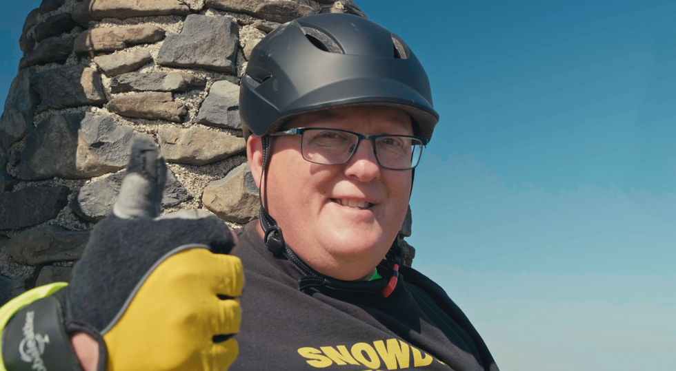 Man with neurological condition ‘elated and emotional’ after climbing Snowdon
