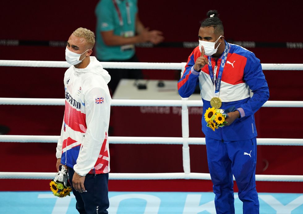 Ben Whittaker and Cuba\u2019s Arlen Lopez on the podium after the Olympic final bout (Mike Egerton/PA)