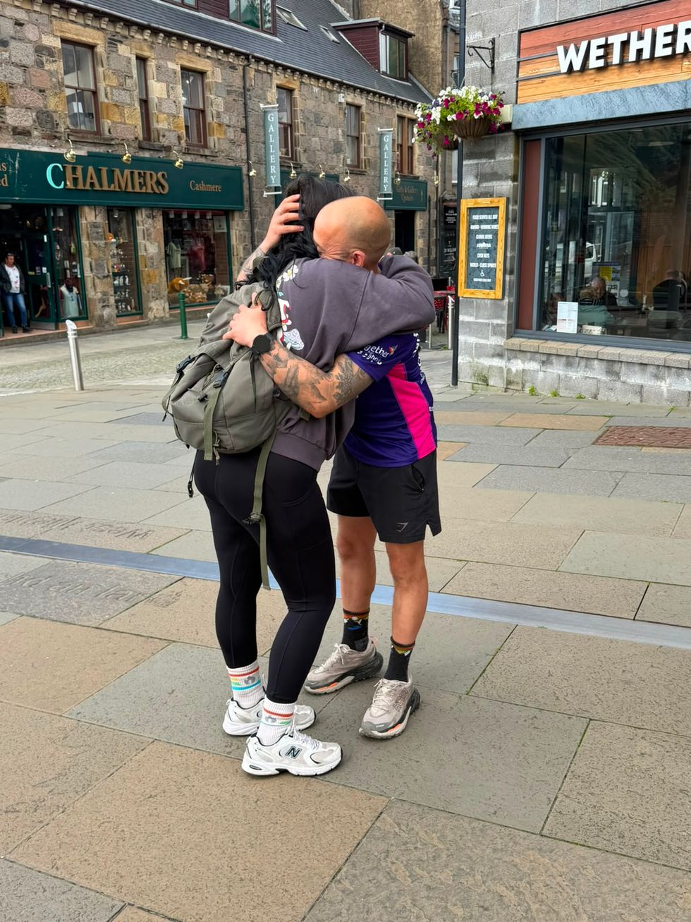 Benjamin Ward and Natasha Goldthorpe hugging on a street