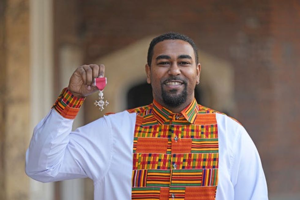 Bhishma Asare after being made an MBE