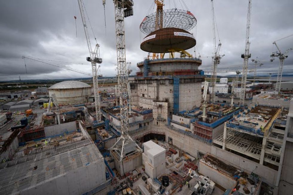 Big Carl, the world\u2019s largest crane, was used to lift the dome into the second reactor at Hinkley Point C (Ben Birchall/PA)