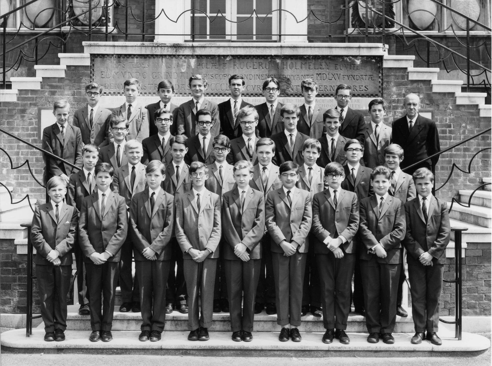 Black and white image of an all boys choir