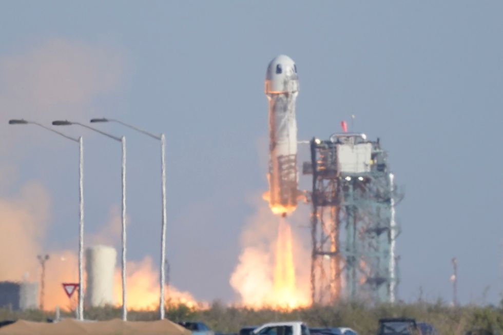 Blue Origin\u2019s New Shepard rocket launched into space carrying passengers William Shatner, Chris Boshuizen, Audrey Powers and Glen de Vries (AP Photo/LM Otero)