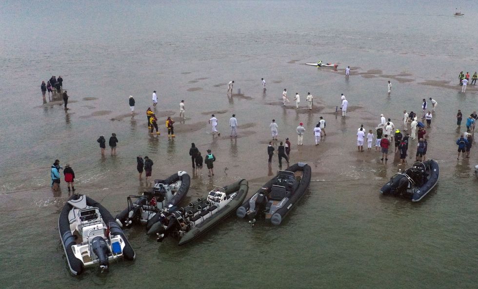 Boats surround the cricketers as play gets under way (Steve Parsons/PA)