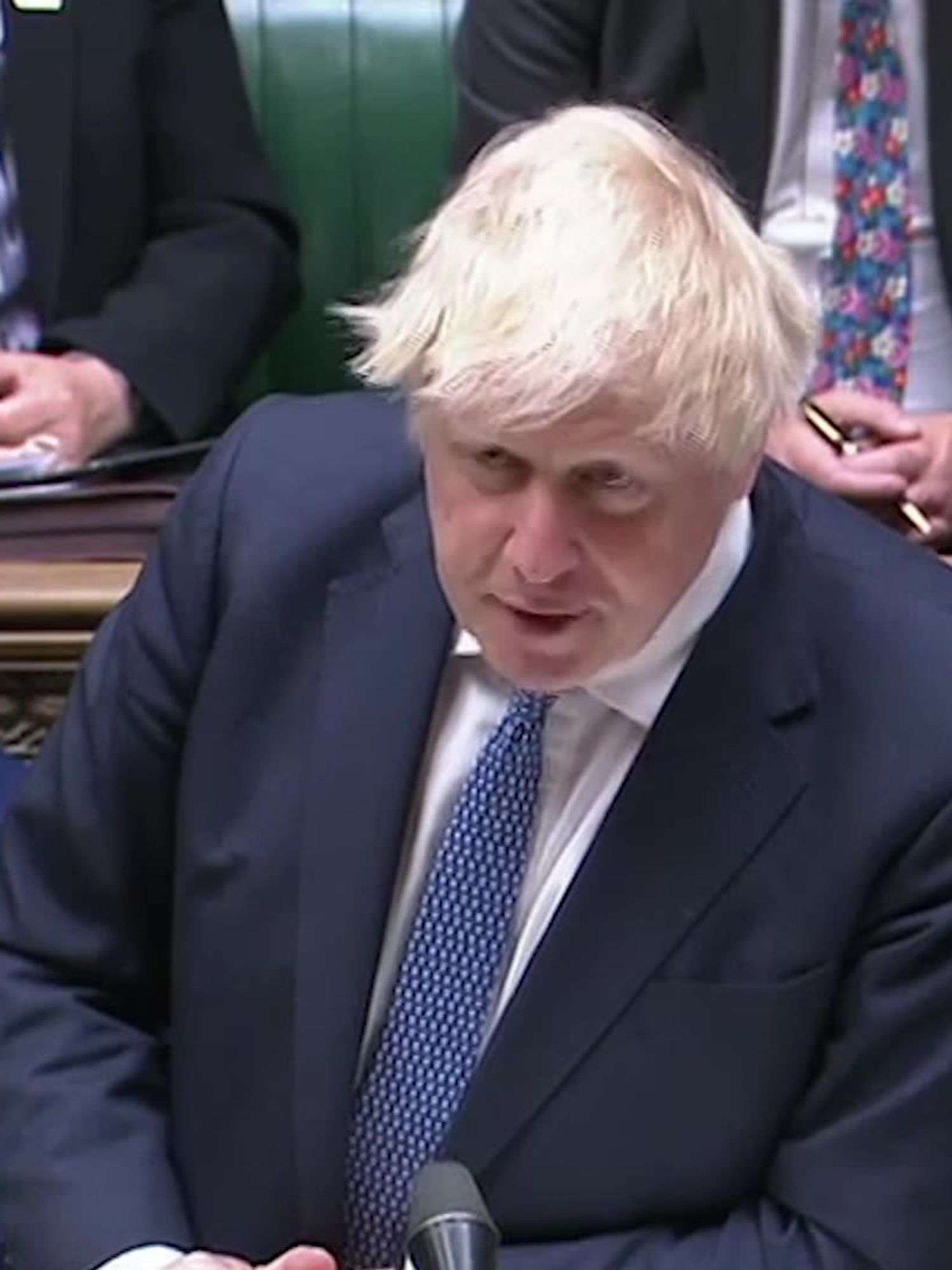Boris Johnson, a white man with short blonde hair and a black suit, speaking at the despatch box in the House of Commons.