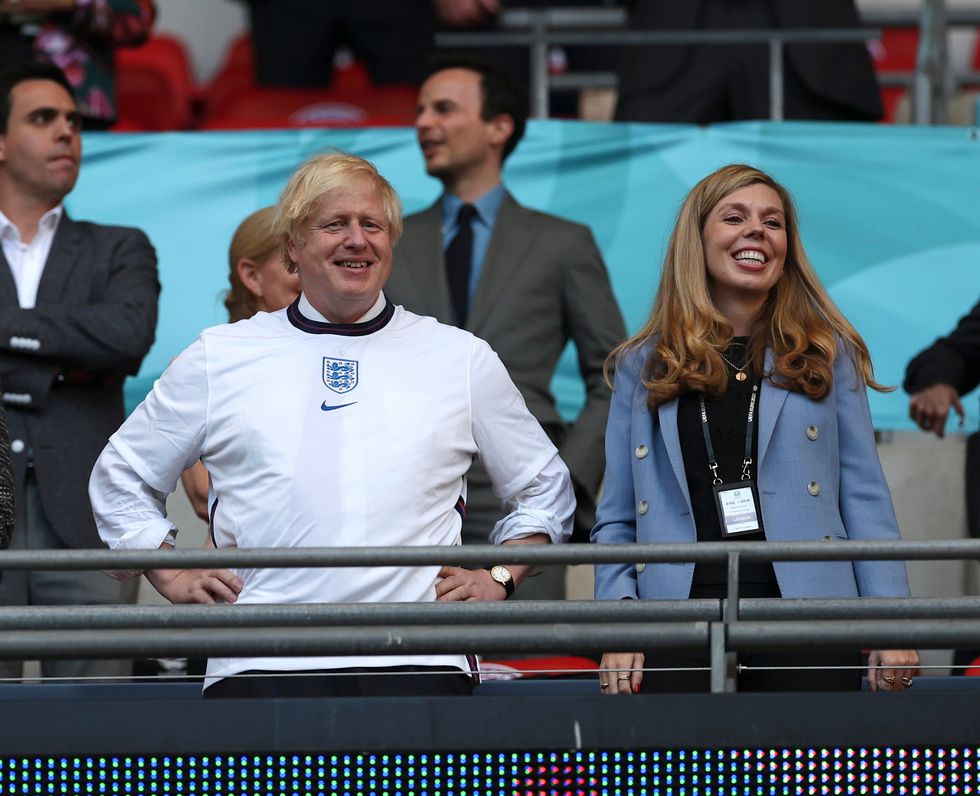 Boris Johnson, Prime Minister of England, and his wife, Carrie Johnson, are seen prior to the UEFA Euro 2020 Championship Semi-final match between England and Denmark at Wembley
