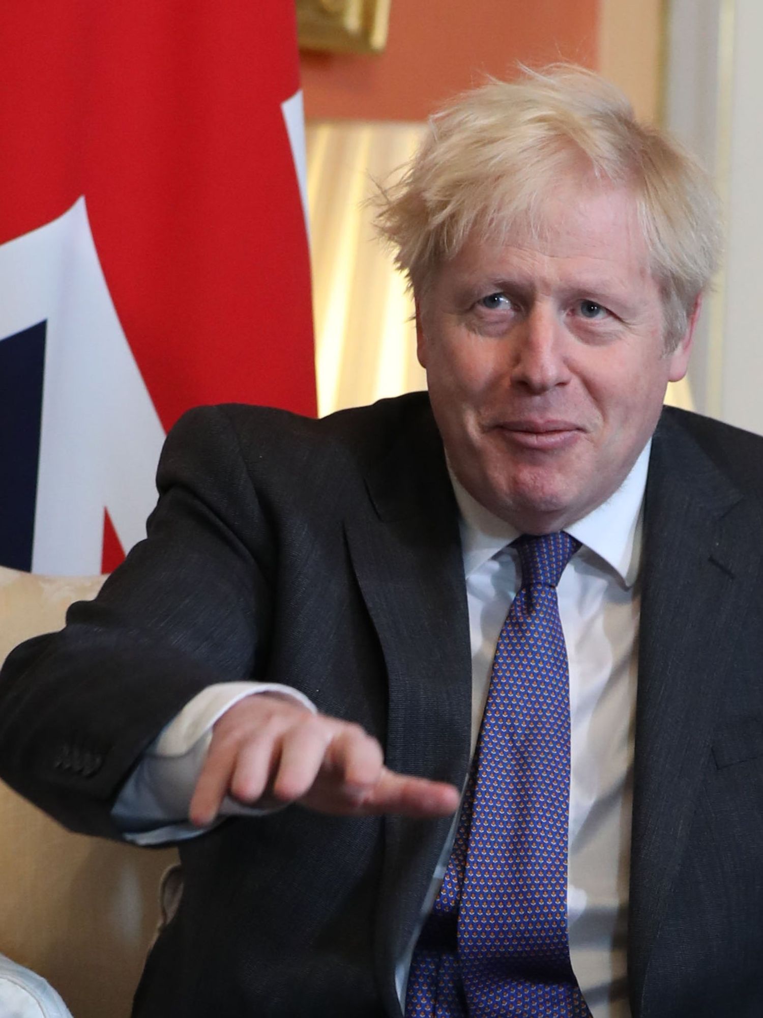 Boris Johnson sits in front of a Union flag inside 10 Downing Street