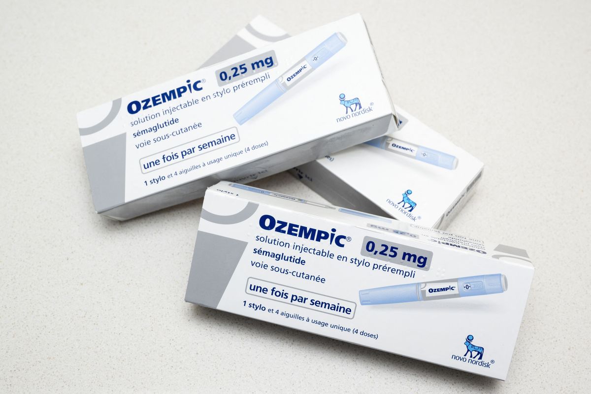 Boxes of Ozempic lay on a white table
