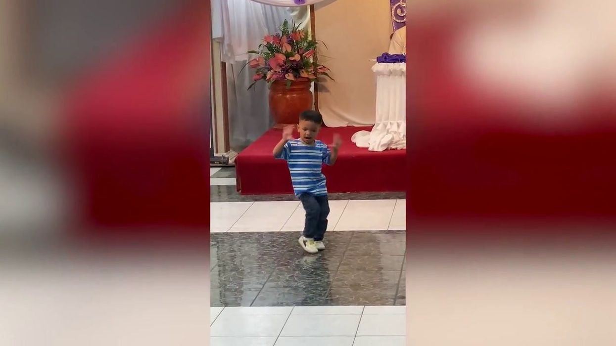 Toddler at wedding sparks debate after wiping her face on bride's dress