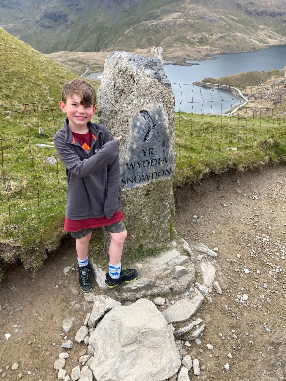 Boy pointing at sign