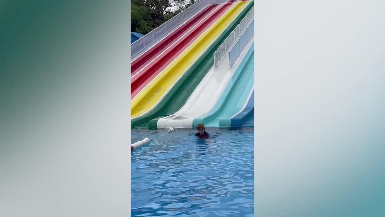 This man's dangerously high waterslide jump has to be seen to be believed