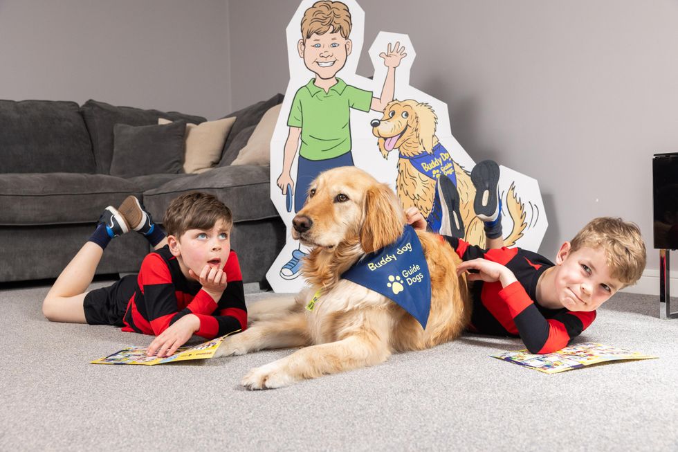 Boys sitting together with dog