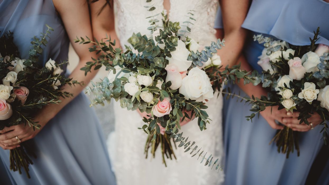 Woman sparks debate after wearing her own wedding dress to friend's wedding