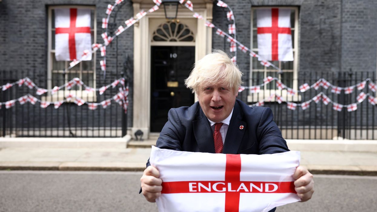 Britain's Boris Johnson at Downing Street with flags ahead of the Euro 2020 final