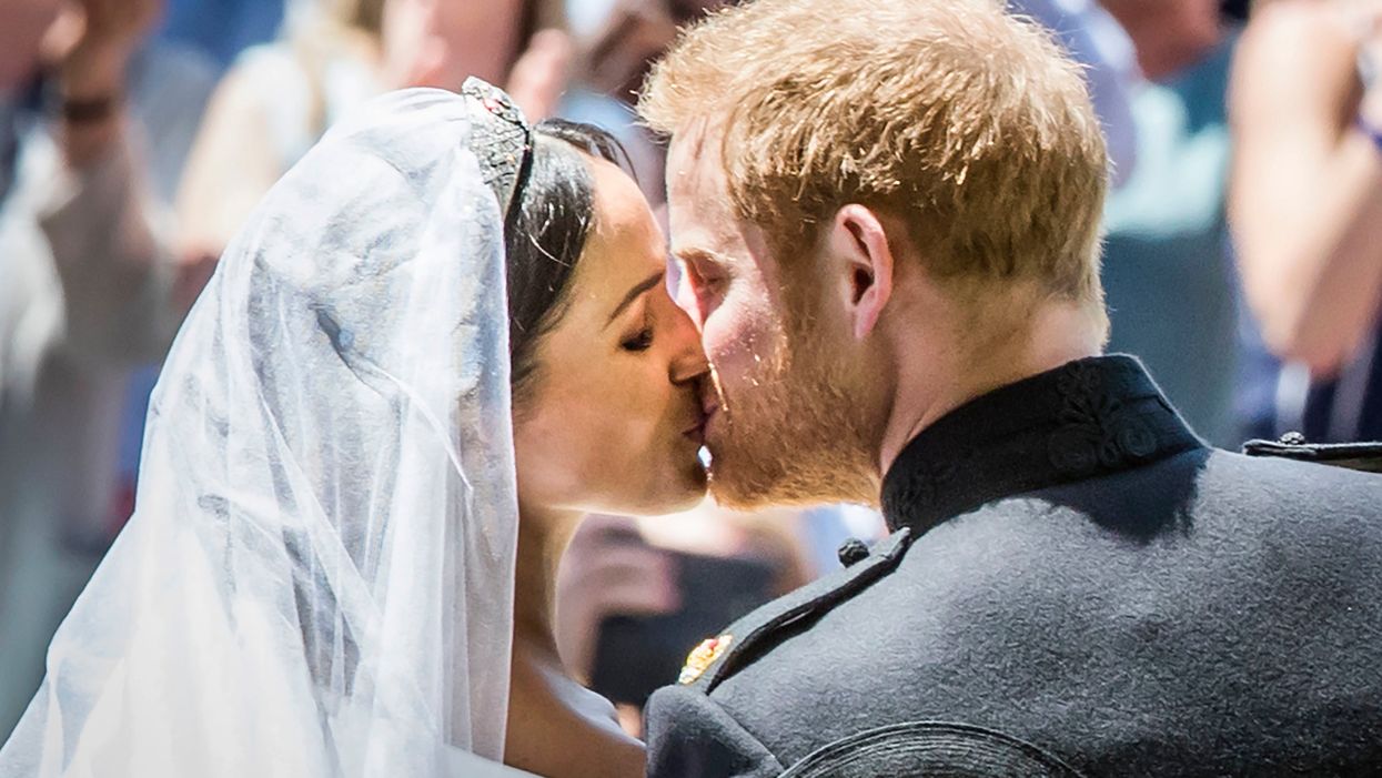 Britain's Prince Harry, Duke of Sussex kisses his wife Meghan, Duchess of Sussex