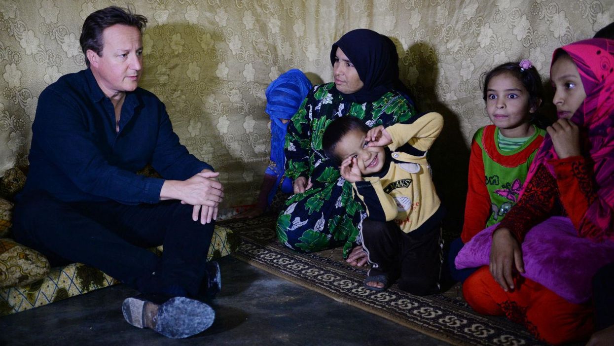 British Prime Minister David Cameron meets Syrian refugee families in the Bekaa Valley, Lebanon, on  September 14, 2015