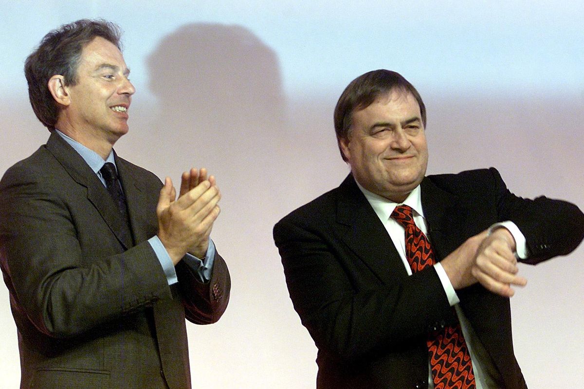 British Prime Minister Tony Blair (L) applauds as Deputy Prime Minister John Prescott says there has been enough time for applause after Prescotts speech 25 September 2000, during the second day of the Labour Party Conference at the Brighton Conference Centre.