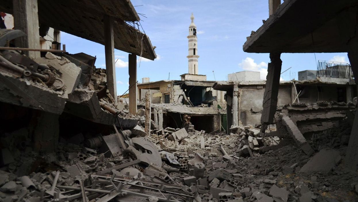 Buildings and a minaret damaged by a Russian airstrike in Talbisseh in Homs province on 30th September 2015
