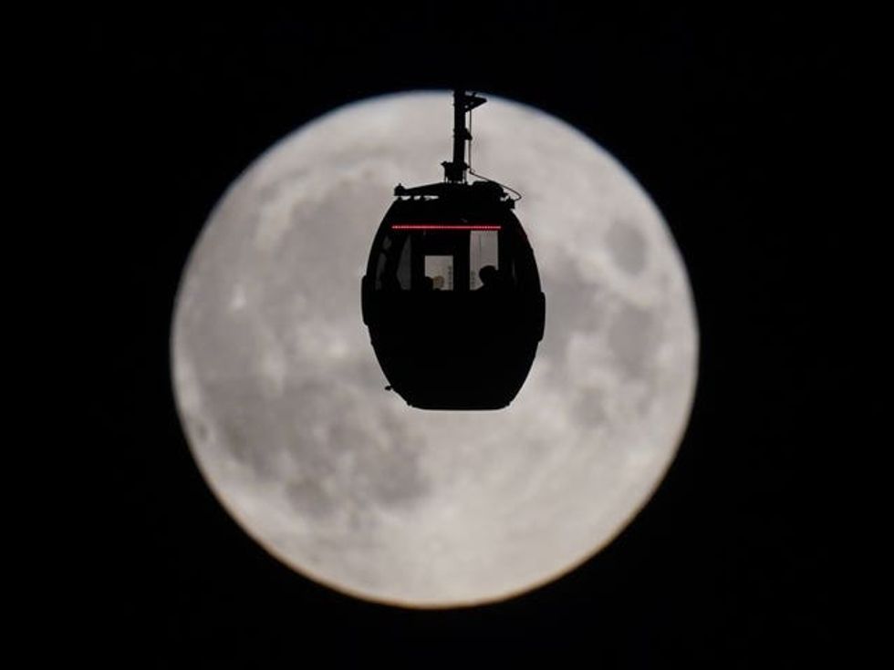 Cable car over the super blue moon